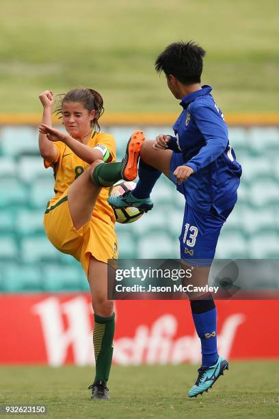 Rachel Lowe of Australia is challenged by Panittha Jeerantanapavibul of Thailand during the International match between the Young Matildas and...