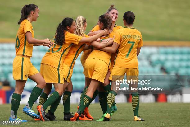 Rachel Lowe of Australia celebrates with team mates after scoring a goal during the International match between the Young Matildas and Thailand at...