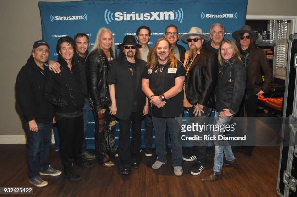 Rickey Medlocke, Gary Rossington and Johnny Van Zant of Lynyrd Skynyrd pose with SiriusXM Vice President of Talent Relations Steve Leeds, SiriusXM...