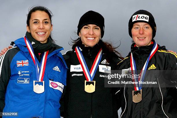 Shelley Rudman of Great Britain, Mellisa Hollingsworth of Canada and Marion Trott of Germany pose for photographers on the winner's podium after the...