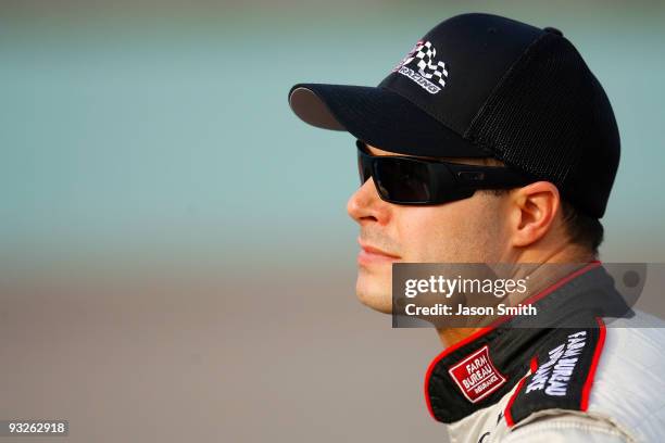 David Gilliland, driver of the Farm Bureau Toyota, stands on the grid during qualifying for the NASCAR Sprint Cup Series Ford 400 at Homestead-Miami...