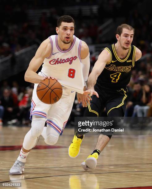 Zach LaVine of the Chicago Bulls drives past Alex Caruso of the Los Angeles Lakers at the United Center on January 26, 2018 in Chicago, Illinois. The...