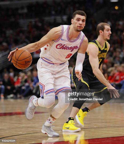 Zach LaVine of the Chicago Bulls drives past Alex Caruso of the Los Angeles Lakers at the United Center on January 26, 2018 in Chicago, Illinois. The...