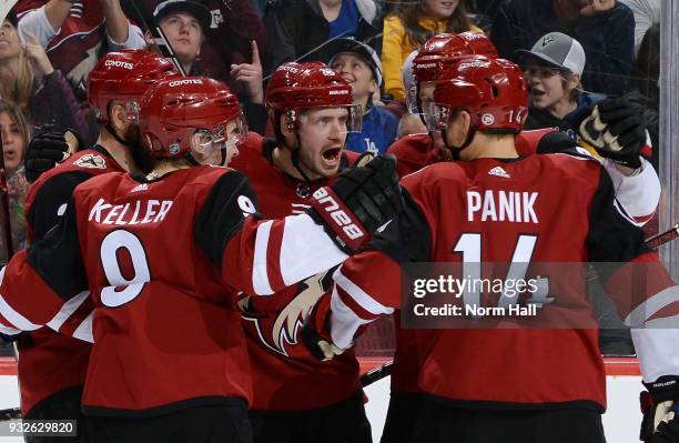 Oliver Ekman-Larsson of the Arizona Coyotes celebrates with teammates Derek Stepan, Clayton Keller, Richard Panik and Jakob Chychrun after his second...