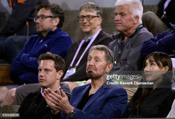 Oracle Co-founder Larry Ellison and Bill Gates in the second row watches Roger Federer of Switzerland battle against Hyeon Chung of Korea during Day...