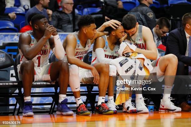 Rawle Alkins, Allonzo Trier, Parker Jackson-Cartwright, and Dusan Ristic of the Arizona Wildcats react on the bench in the second half against the...