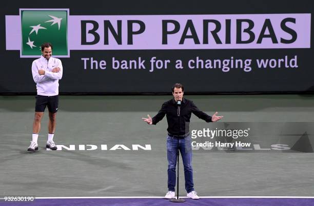 Tommy Haas of Germany gives a retirement speech in front of Roger Federer of Switzerland during the BNP Paribas Open at the Indian Wells Tennis...