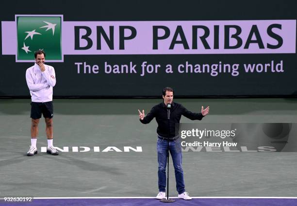 Tommy Haas of Germany gives a retirement speech in front of Roger Federer of Switzerland during the BNP Paribas Open at the Indian Wells Tennis...