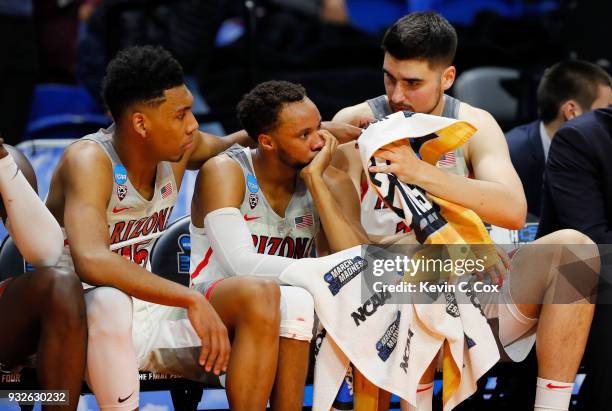 Allonzo Trier, Parker Jackson-Cartwright, and Dusan Ristic of the Arizona Wildcats react on the bench in the second half against the Buffalo Bulls...