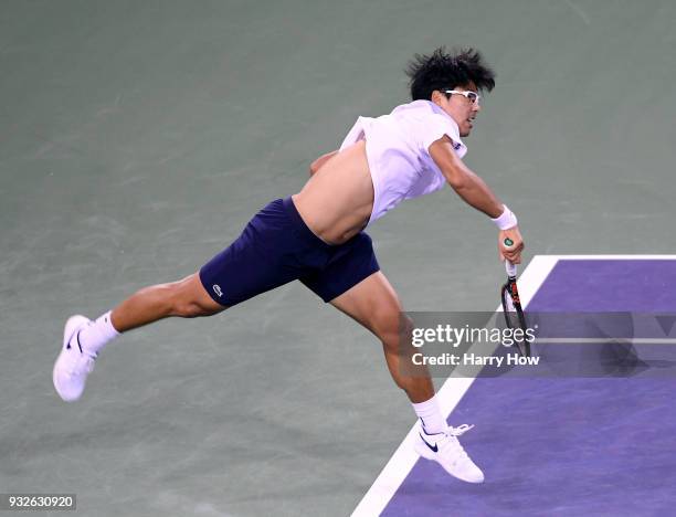 Hyeon Chung of South Korea serves in his quaterfinal loss to Roger Federer of Switzerland during the BNP Paribas Open at the Indian Wells Tennis...