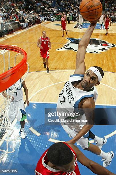 Corey Brewer of the Minnesota Timberwolves hooks a shot over Aaron Brooks of the Houston Rockets during the game on November 18, 2009 at the Target...