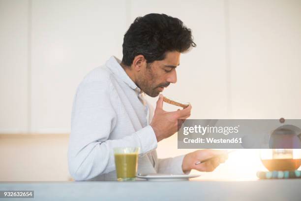 businessman having breakfast at home - smoothie sparse stock pictures, royalty-free photos & images