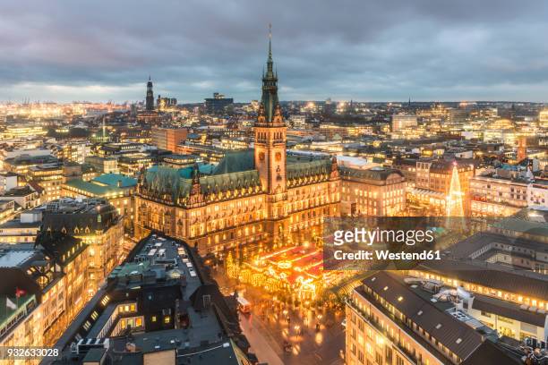 germany, hamburg, christmas market at town hall in the evening - hamburg germany stock pictures, royalty-free photos & images