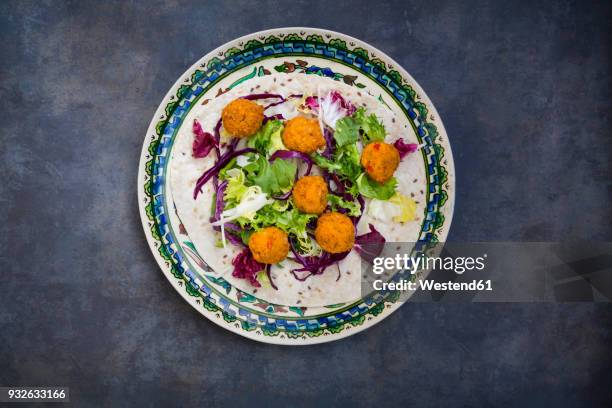 falafel, wrap, salad, red and white cabbage, yogurt sauce with mint - middle east culture stock pictures, royalty-free photos & images