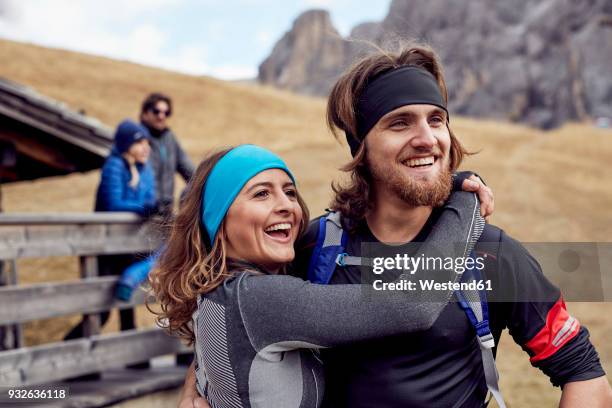 happy friends having a break at mountain hut - young male hiker stock pictures, royalty-free photos & images