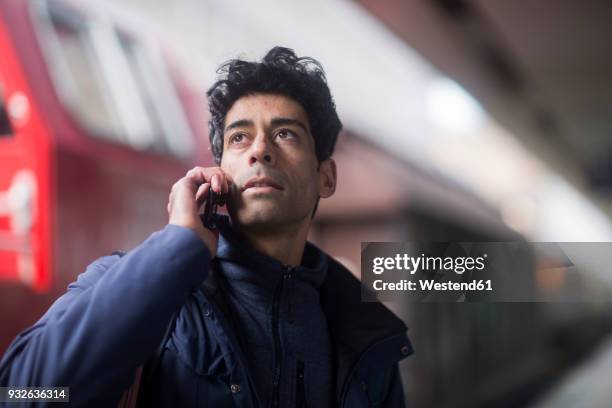 portrait of man on the phone waiting on platform - commuter train stock pictures, royalty-free photos & images