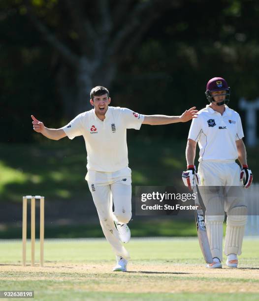 England bowler Craig Overton celebrates after dismissing batsman Nathan Smith during day one of the Test warm up match between England and New...