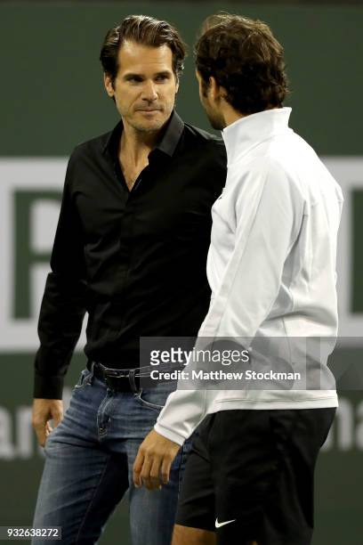 Tommy Haas leaves the court with Roger Federer after officially announcing his retirement at a ceremony after the Roger Federer quarterfnal match...