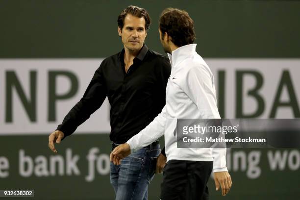 Tommy Haas leaves the court with Roger Federer after officially announcing his retirement at a ceremony after the Roger Federer quarterfnal match...