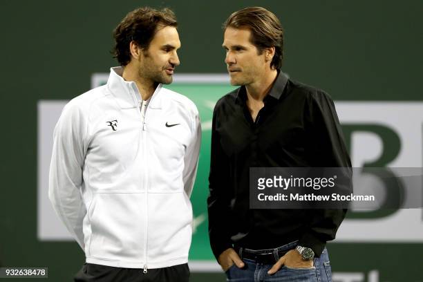 Roger Federer and Tommy Haas wait for a video tribute to begin before Haas officially announcing his retirement at a ceremony after the Roger Federer...