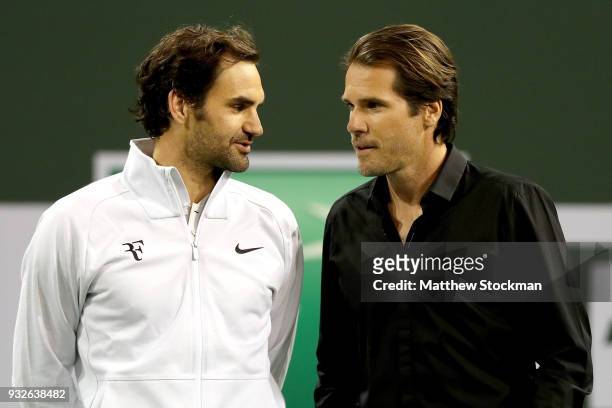 Roger Federer and Tommy Haas wait for a video tribute to begin before Haas officially announcing his retirement at a ceremony after the Roger Federer...