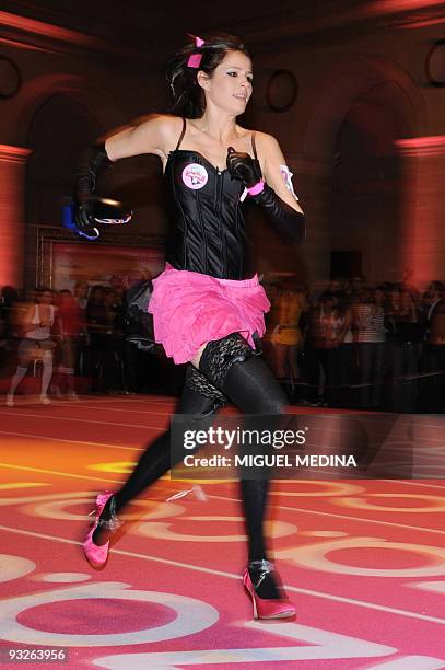 Woman competes for the "Race on Heels" on November 20, 2009 in Paris.A total 96 shoe addicts, a common condition with fashionistas, have signed up...