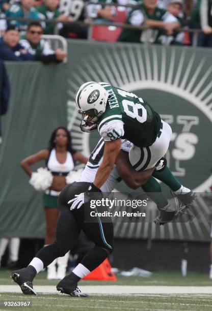 Defensive End Julius Williams of the Jacksonville Jaguars hits Tight End Dustin Keller of the New York Jets as he goes high when the New York Jets...