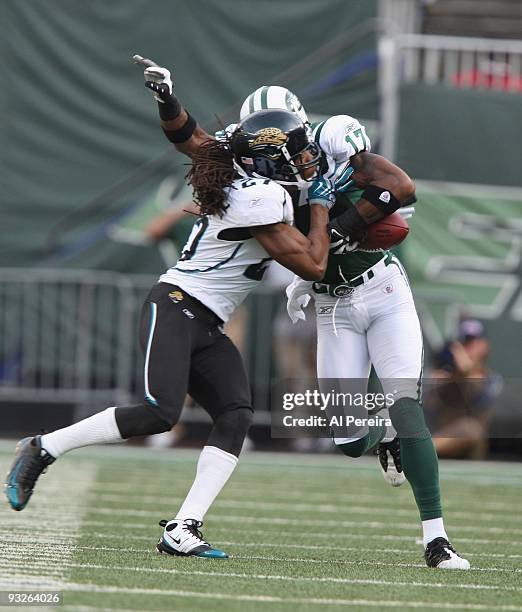 Cornerback Rasheen Mathis of the Jacksonville Jaguars causes a fumble after Wide Receiver Braylon Edwards of the New York Jets has a long gain when...