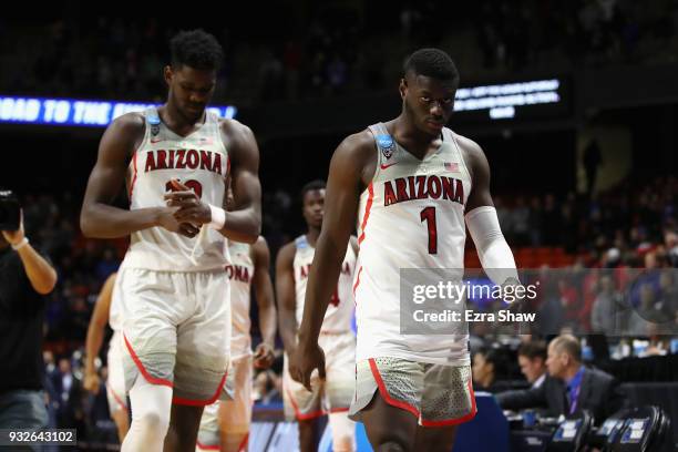 Deandre Ayton and Rawle Alkins of the Arizona Wildcats leave the court after being defeated by the Buffalo Bulls 89-68 during the first round of the...