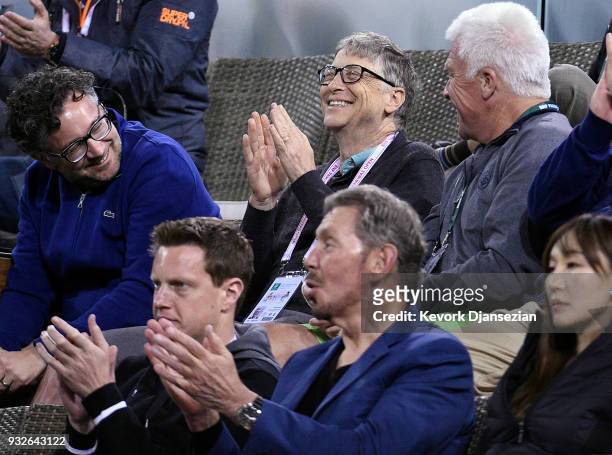 Bill Gates and Oracle Co-founder Larry Ellison attend the tennis match between Roger Federer of Switzerland battle against Hyeon Chung of Korea...