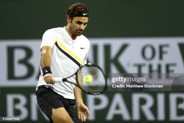 Roger Federer of Switzerland returns a shot to Hyeon Chung of Korea during of the BNP Paribas Open at the Indian Wells Tennis Garden on March 15,...