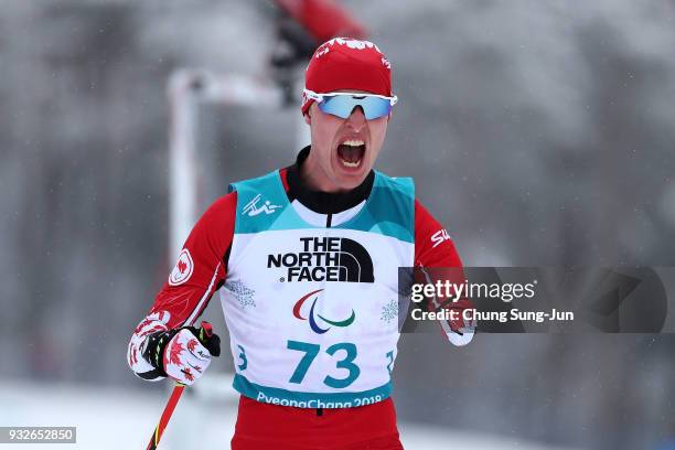 Mark Arendz of Canada celebrates after winning the Biathlon - Men's 15km - Standing during day seven of the PyeongChang 2018 Paralympic Games on...