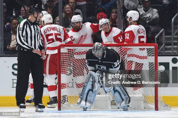 Niklas Kronwall, Henrik Zetterberg, Gustav Nyquist, and Jonathan Ericsson of the Detroit Red Wings celebrate after scoring a goal against the Los...