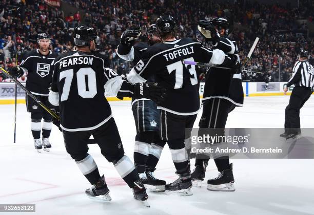Tyler Toffoli, Drew Doughty, Tanner Pearson, and Derek Forbort of the Los Angeles Kings celebrate after scoring a goal against the Detroit Red Wings...