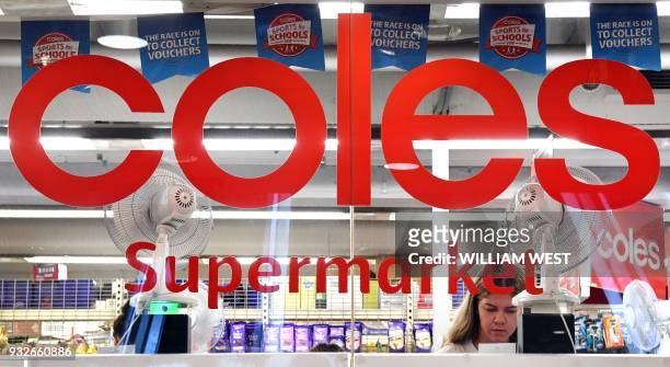 Woman is seen shopping at a Coles supermarket in the central business district of Sydney on March 16, 2018. Australian supermarket chain Coles will...