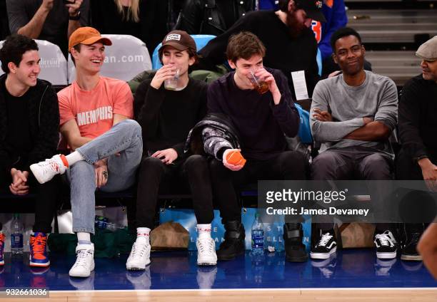 Ansel Elgort, Timothee Chalamet, guest and Chris Rock attend New York Knicks Vs Philadelphia 76ers game at Madison Square Garden on March 15, 2018 in...