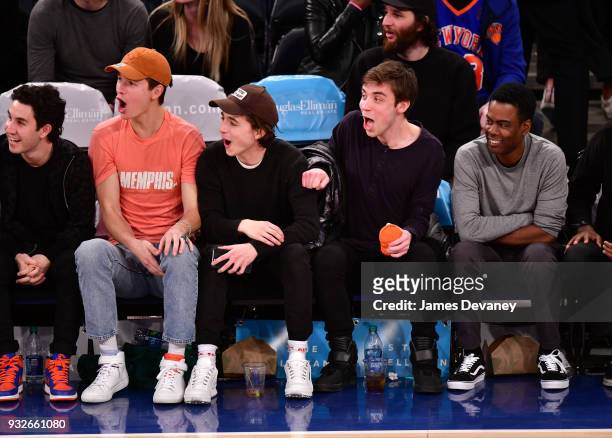 Ansel Elgort, Timothee Chalamet, guest and Chris Rock attend New York Knicks Vs Philadelphia 76ers game at Madison Square Garden on March 15, 2018 in...