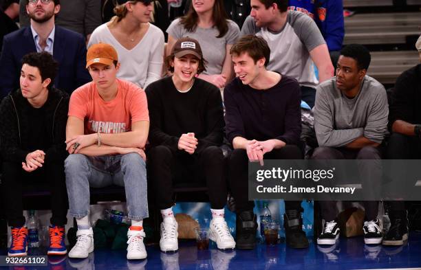 Ansel Elgort, Timothee Chalamet, guest and Chris Rock attend New York Knicks Vs Philadelphia 76ers game at Madison Square Garden on March 15, 2018 in...