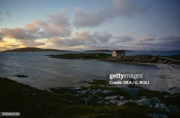 Farmhouse on a spit of land, Barra island, Outer Hebrides, Scotland, United Kingdom.