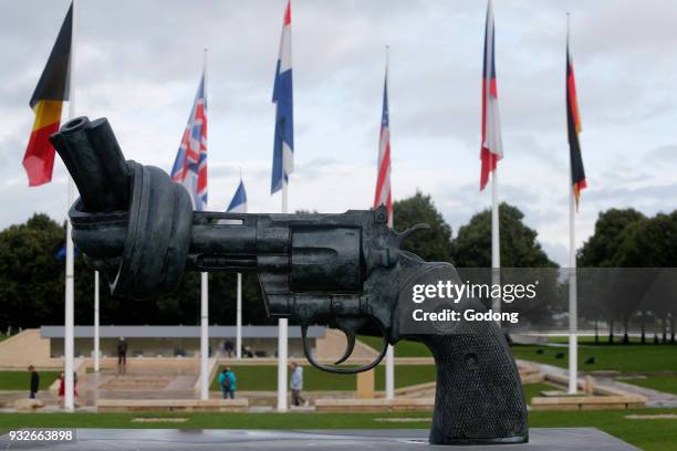 Bronze sculpture outside the Memorial de la Paix in Caen : Non violence - the knotted gun, by Carl Fredrik Reutersward. France.