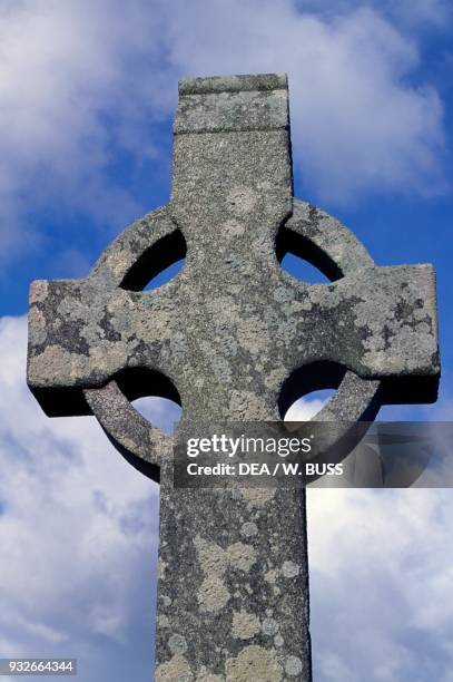 Monolithic cross in the monastic complex on the banks of the River Shannon, Clonmacnoise, County Offaly, Ireland.