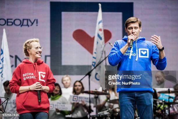 Russian politician Dmitry Gudkov, right side, gives a speech during a meeting of Ksenia Sobchak, left side, presidential candidate from the Civic...