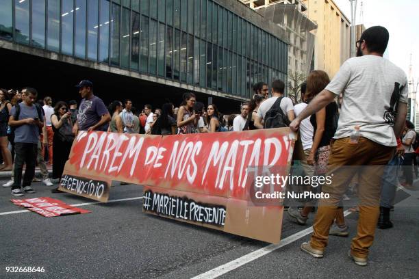 Protesters protest against the murders of councilwoman Marielle Franco and Anderson Pedro Gomes at Avenida Paulista in Sao Paulo, Brazil, on 15 March...