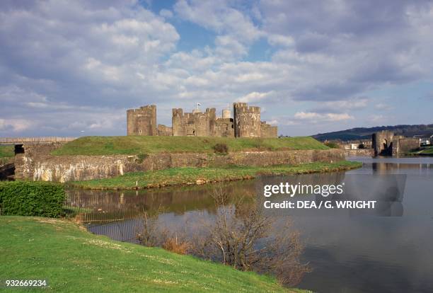 The moat and Caerphilly castle, largest medieval fortress of Wales, United Kingdom, 12th century.