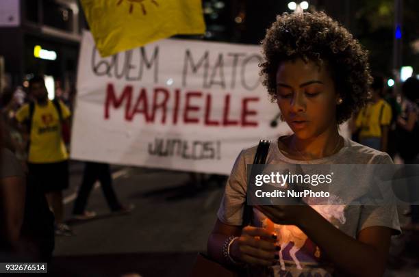 Thousands of people gather in Paulista Avenue, downtown Sao Paulo, in a demonstration in memory of Marielle Franco, killed this wednesday in Rio de...