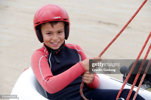 Year-old boy on a sand yacht. France.