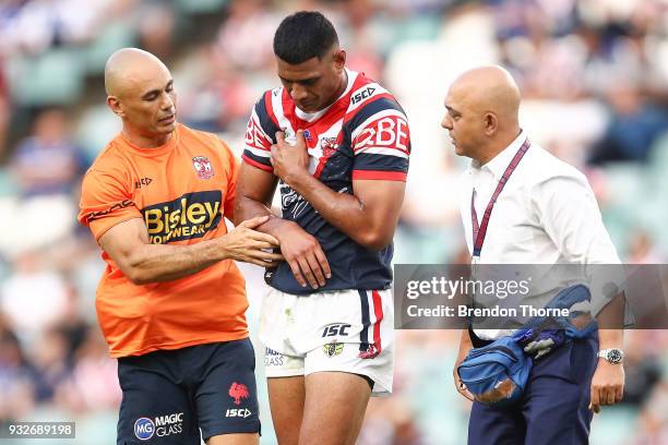 Daniel Tupou of the Roosters is assisted from the field during the round two NRL match between the Sydney Roosters and the Canterbury Bulldogs at...