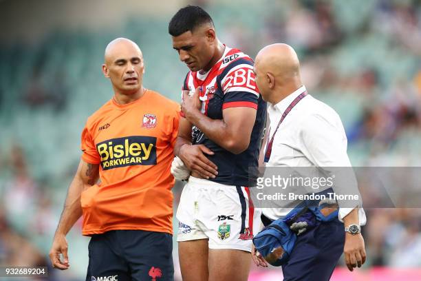 Daniel Tupou of the Roosters is assisted from the field during the round two NRL match between the Sydney Roosters and the Canterbury Bulldogs at...