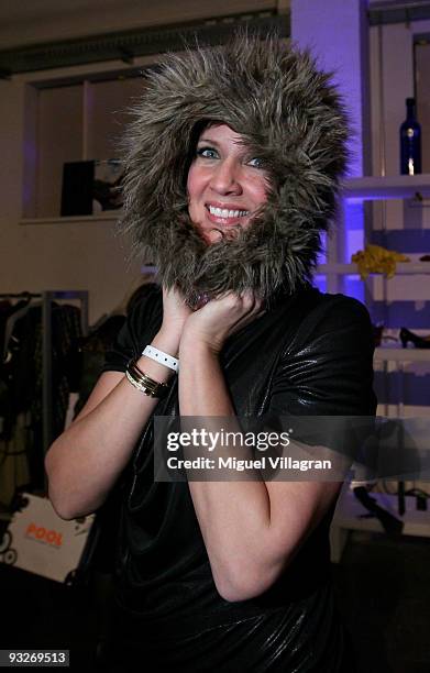 Dana Schweiger poses with a hat during the Skyy swap market on November 20, 2009 in Munich, Germany.