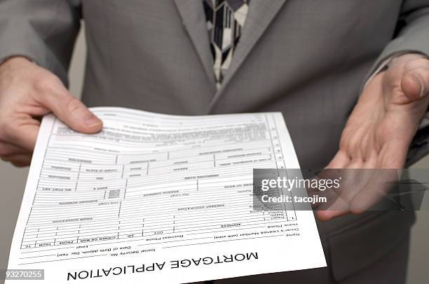 aplicación de mortgage - business person handing over a letter fotografías e imágenes de stock